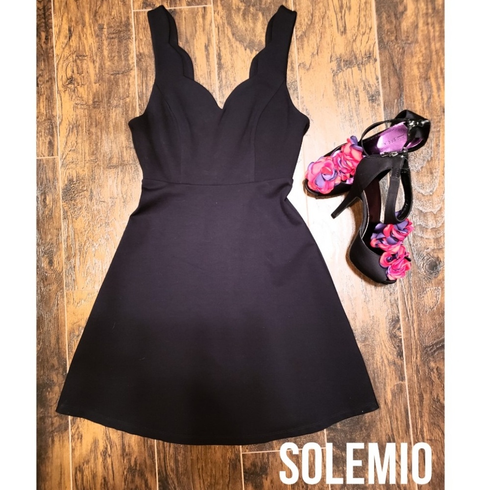 Flirty deep plunge black mini dress